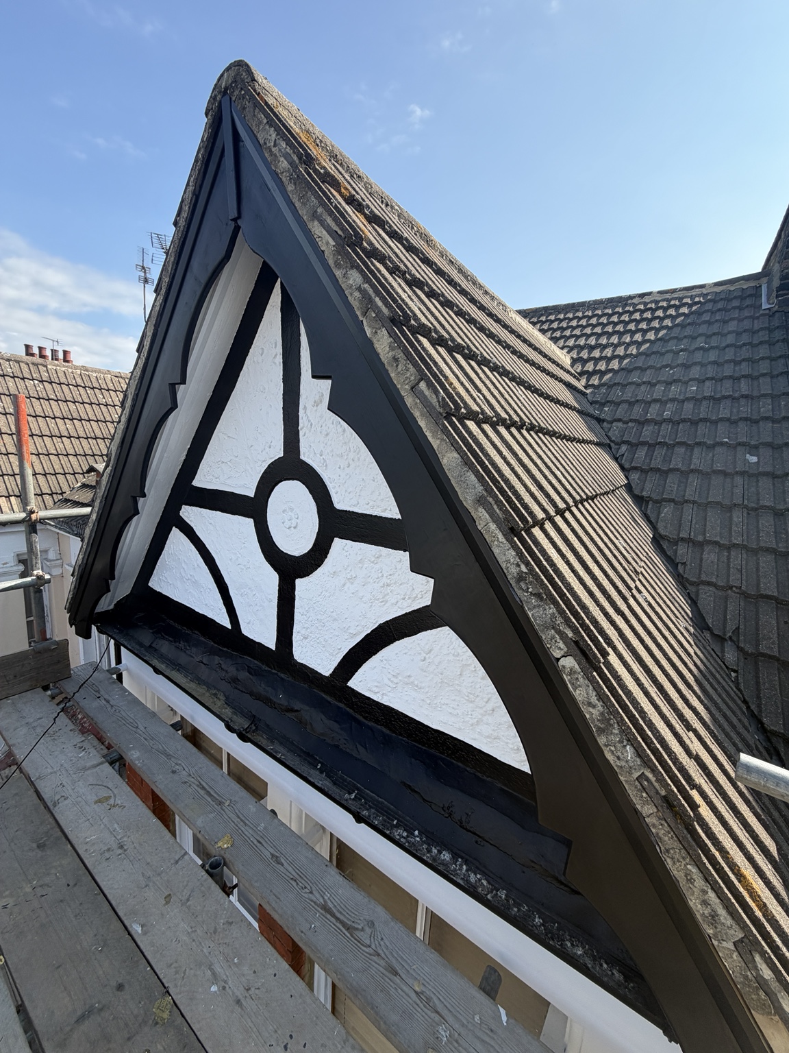 Black and white exterior gable after decorating