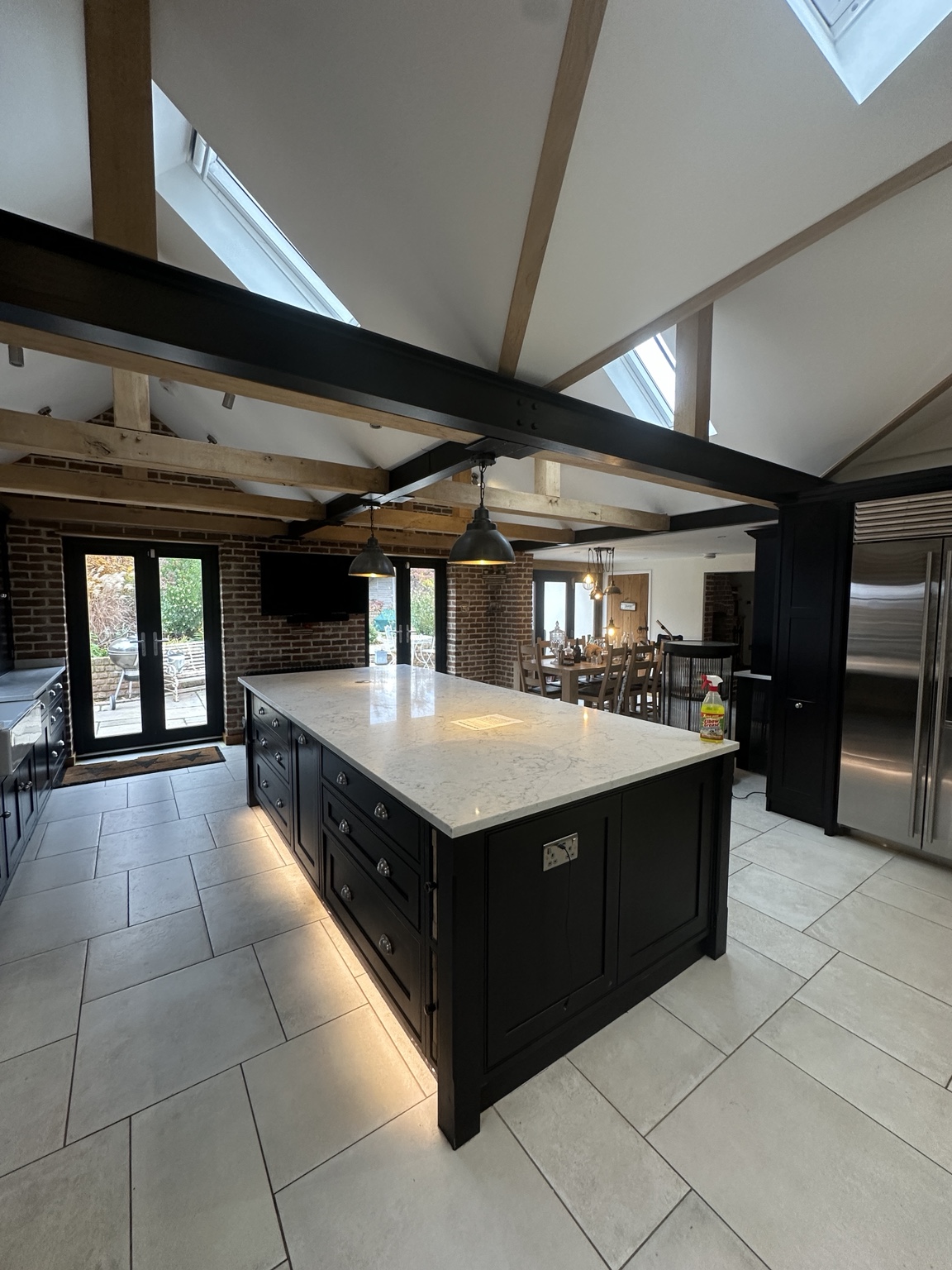 Decorated vaulted kitchen with timber beams and light ceilings